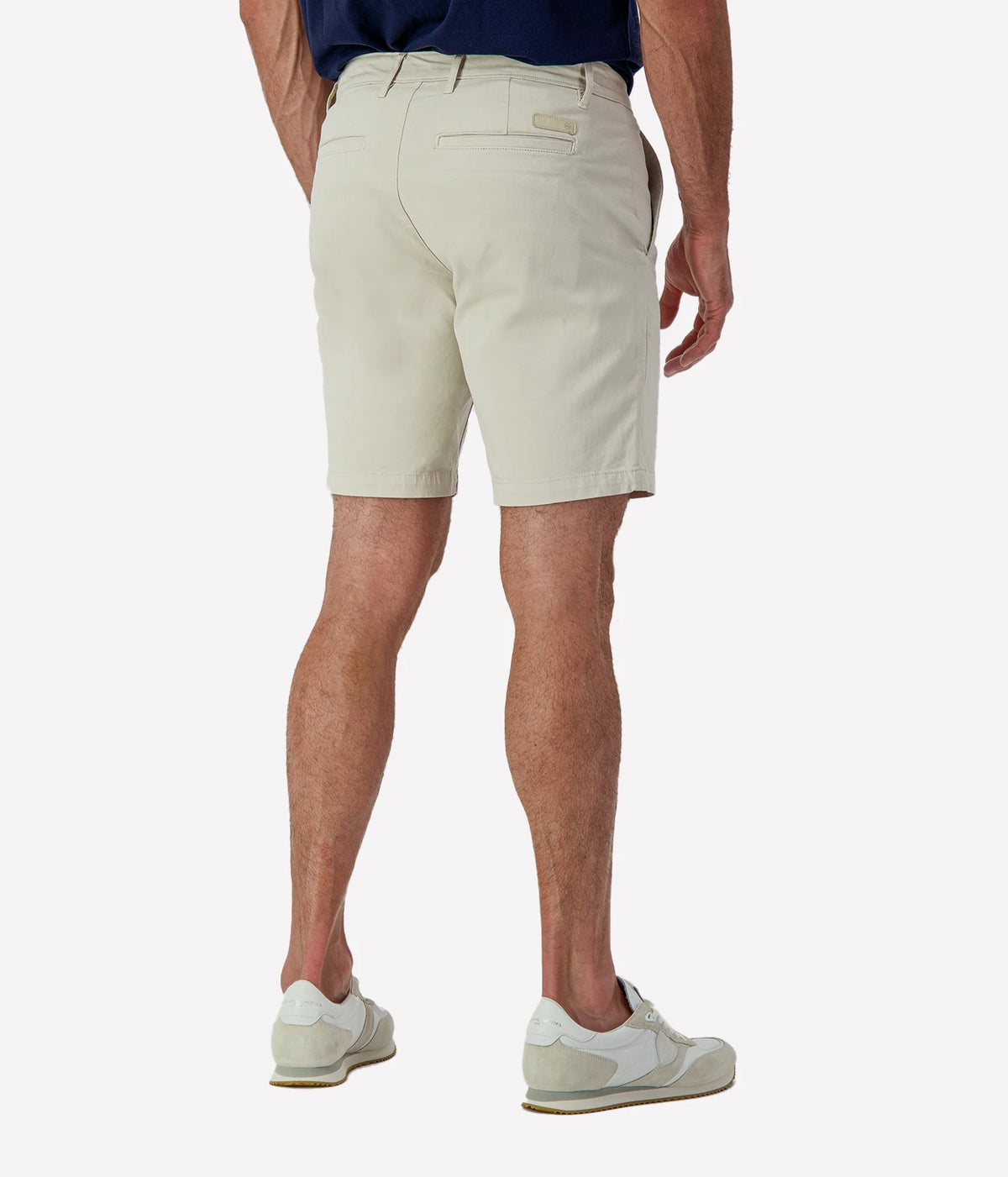 Man wearing AG Wanderer Short in Pumice, cropped back view
