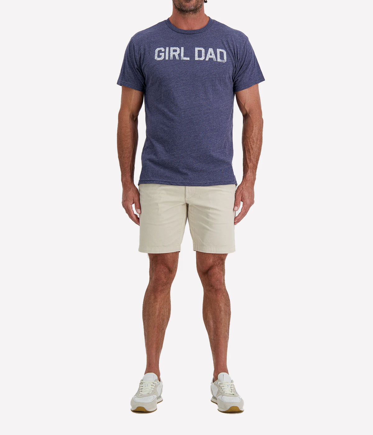 Man wearing Retro Brand Girl Dad Tee in Navy with stone shorts and white sneakers, full-length front view