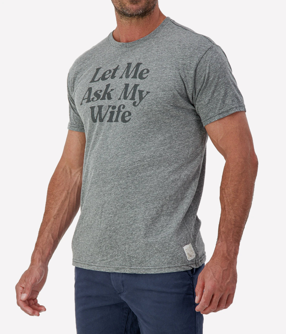 Man wearing Retro Brand Let Me Ask My Wife Tee in Grey with navy shorts, cropped angled front view