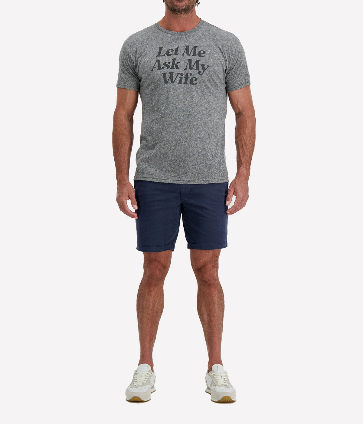 Man wearing Retro Brand Let Me Ask My Wife Tee in Grey with navy shorts and white sneakers, full-length front view