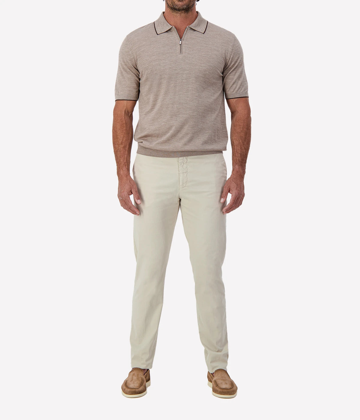 Man wearing Maurizio Baldassari Fine Wool Zip Polo in Beige with stone trousers and tan loafers, full-length front view