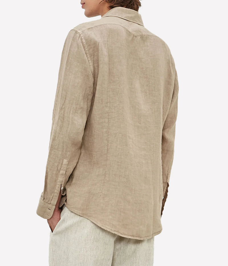 Lightweight linen shirt with a soft collar, embroidered detailing, and a refined fit.