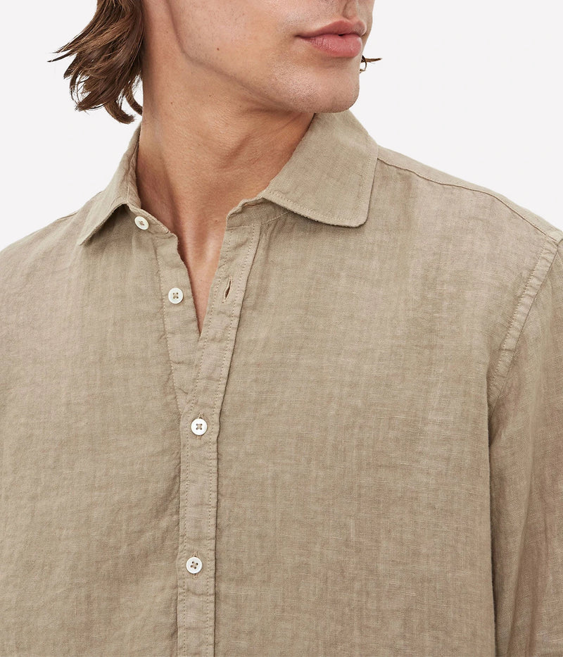 Lightweight linen shirt with a soft collar, embroidered detailing, and a refined fit.