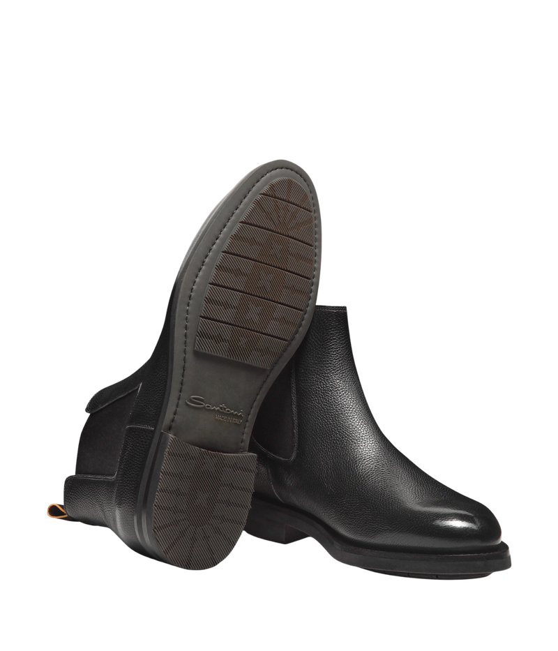 Men’s black leather Chelsea boots with elastic side panels, pull tab, and durable rubber sole by Santoni.