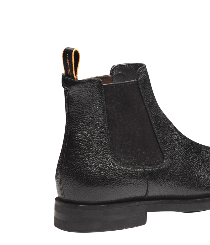 Men’s black leather Chelsea boots with elastic side panels, pull tab, and durable rubber sole by Santoni.