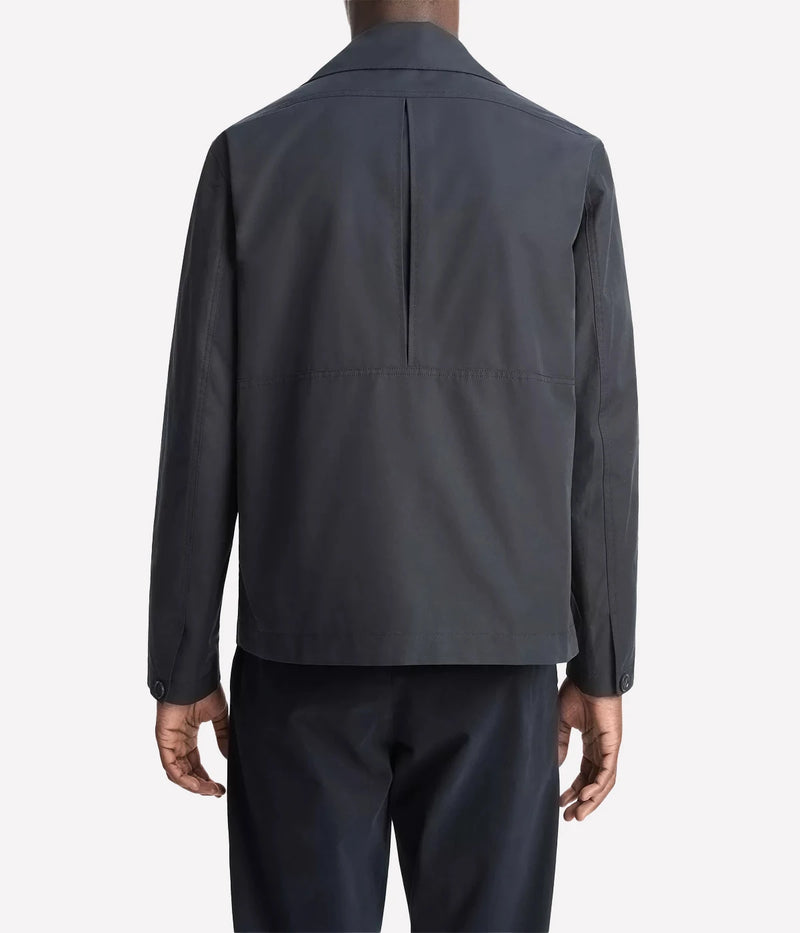 Vince men’s lightweight cotton-blend jacket in a soft peached finish with convertible collar, zip and snap front, and gusseted back for movement.