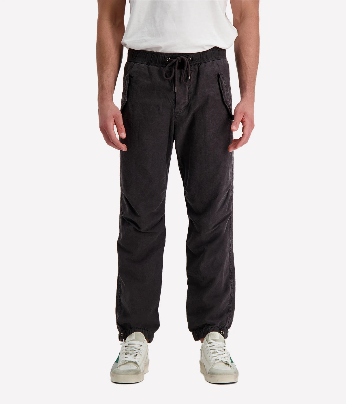 Textured cotton hemp flight pants in a relaxed fit, featuring a button fly, cuffed leg opening, knee tuck details, and snap button flap pockets. Crafted from breathable Italian cotton hemp with a unique textured finish.