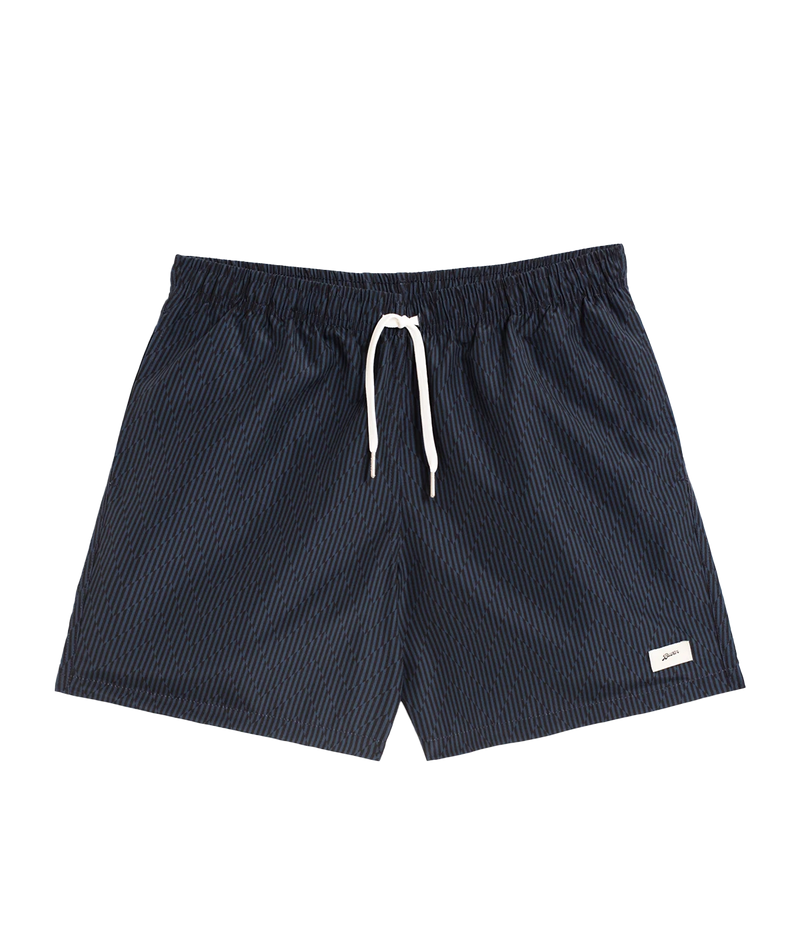 Bather’s geometric swim trunks feature a bold, monochromatic herringbone-inspired pattern, reminiscent of retro ‘60s design. With a 5.5” inseam, reinforced pockets, and a back snap pocket, these quick-dry swim shorts are crafted from 100% recycled polyester for a stylish and sustainable fit.