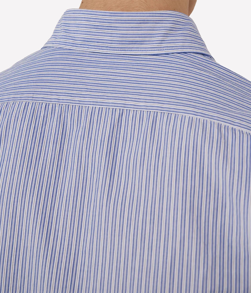 Close-up of the back of a blue and white striped button-down shirt on a model, showing the fabric texture and collar.