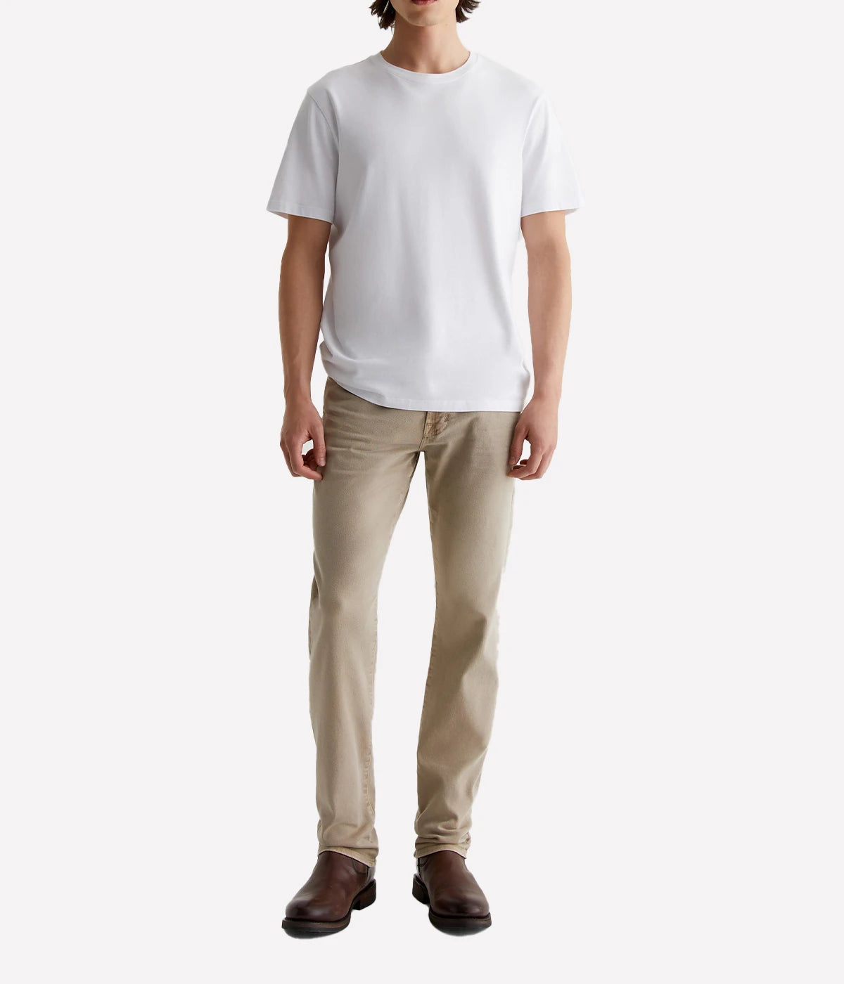 The Everett slim-straight jeans in sulfur-dyed khaki offer a relaxed fit with a tapered leg, AG-ed™ fading, and a velvety-soft feel thanks to Cloud Soft Denim™. Stretch and recovery ensure all-day comfort.