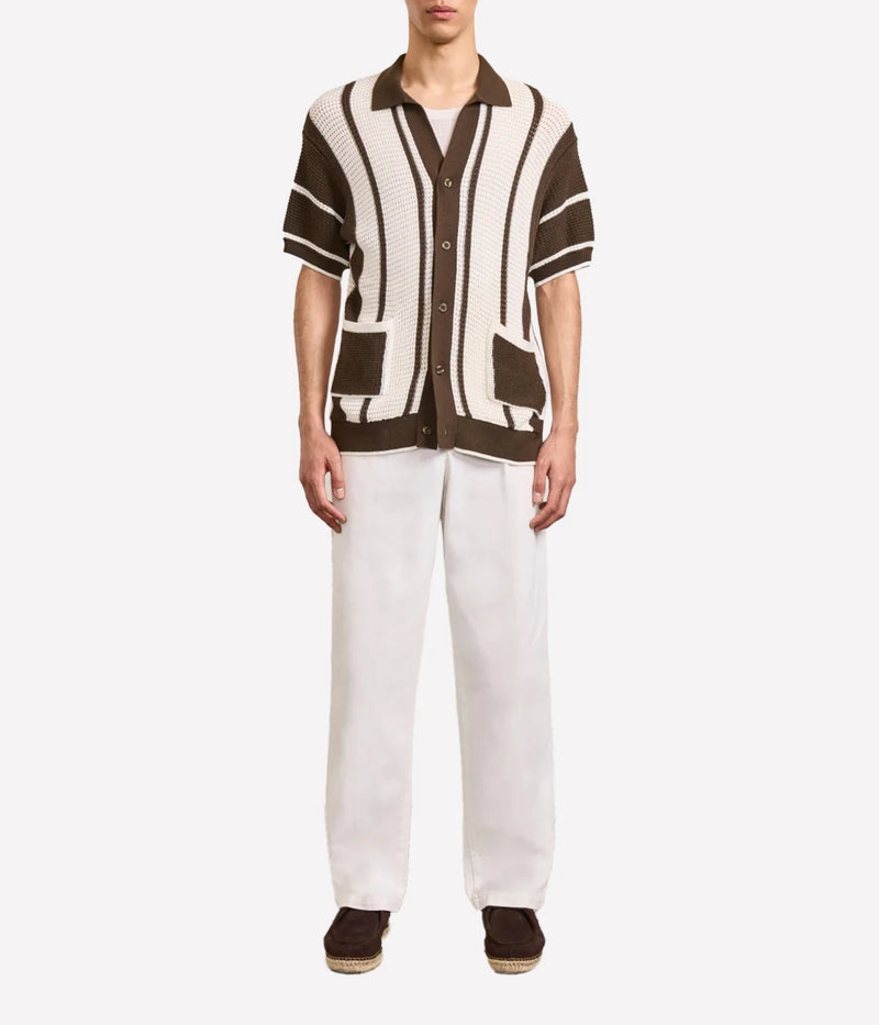 Fabricio Cardigan in 100% cotton with a pointelle knit and striped design. Featuring a relaxed fit, open collar, button-up front with branded mother-of-pearl buttons, front patch pockets, and ribbed hem and cuffs.