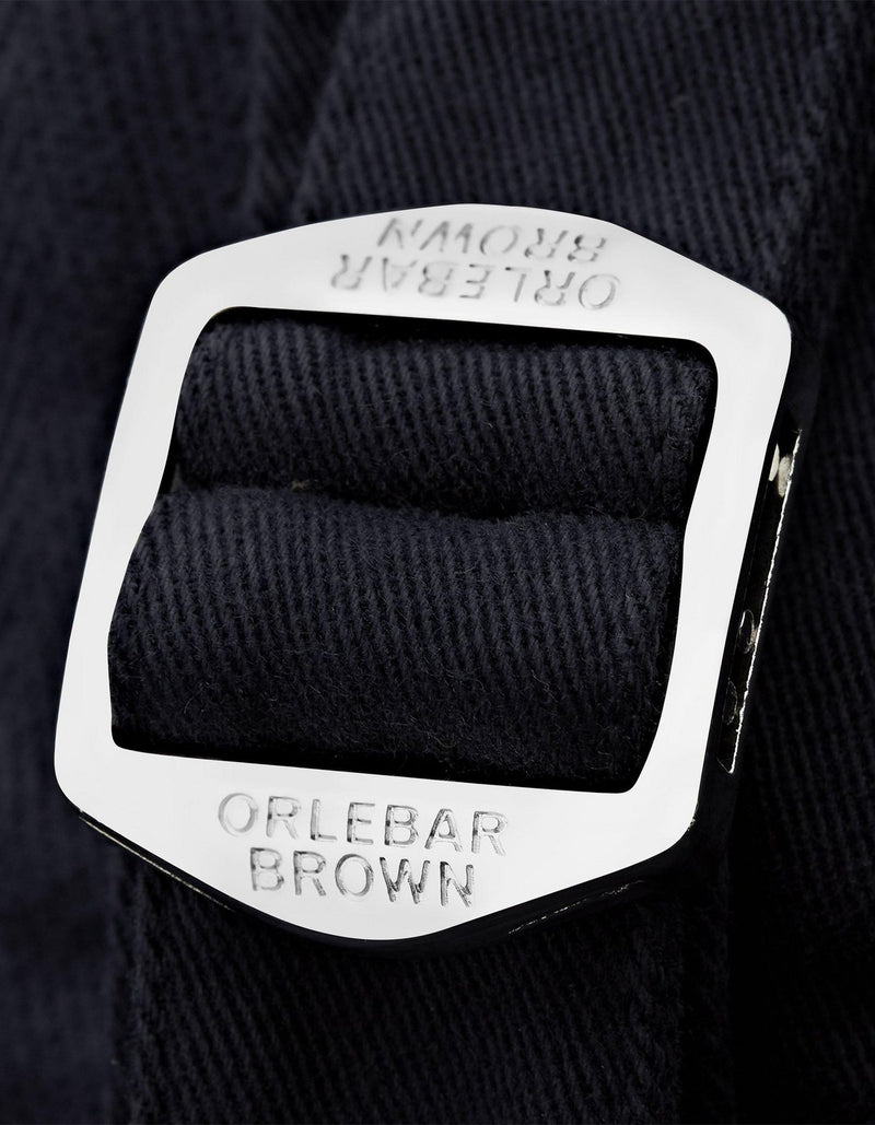 Fallon Dark Navy trousers with tailored fit, adjustable side fasteners, and multiple pockets. Made from stretch-cotton twill for comfort and versatility, perfect for both casual and dressy looks.