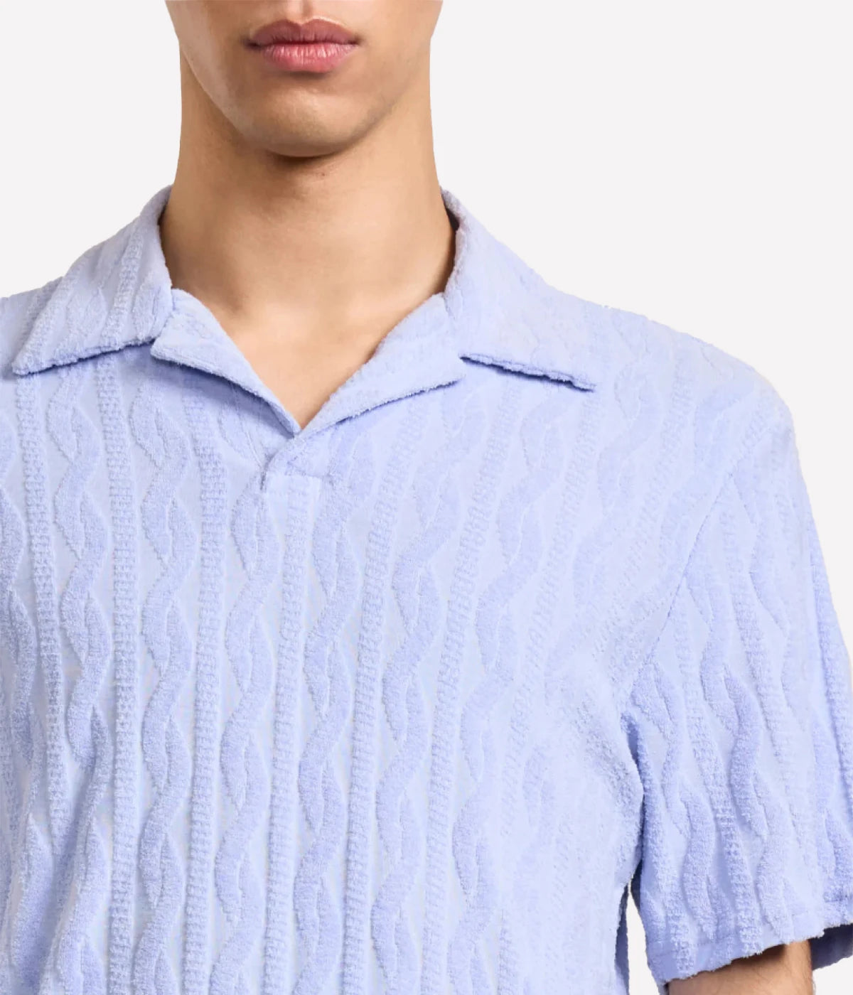 Faustino polo in organic Terry cotton with jacquard pattern, open camp collar, relaxed fit, and side slits. Buttonless collar for a modern twist.