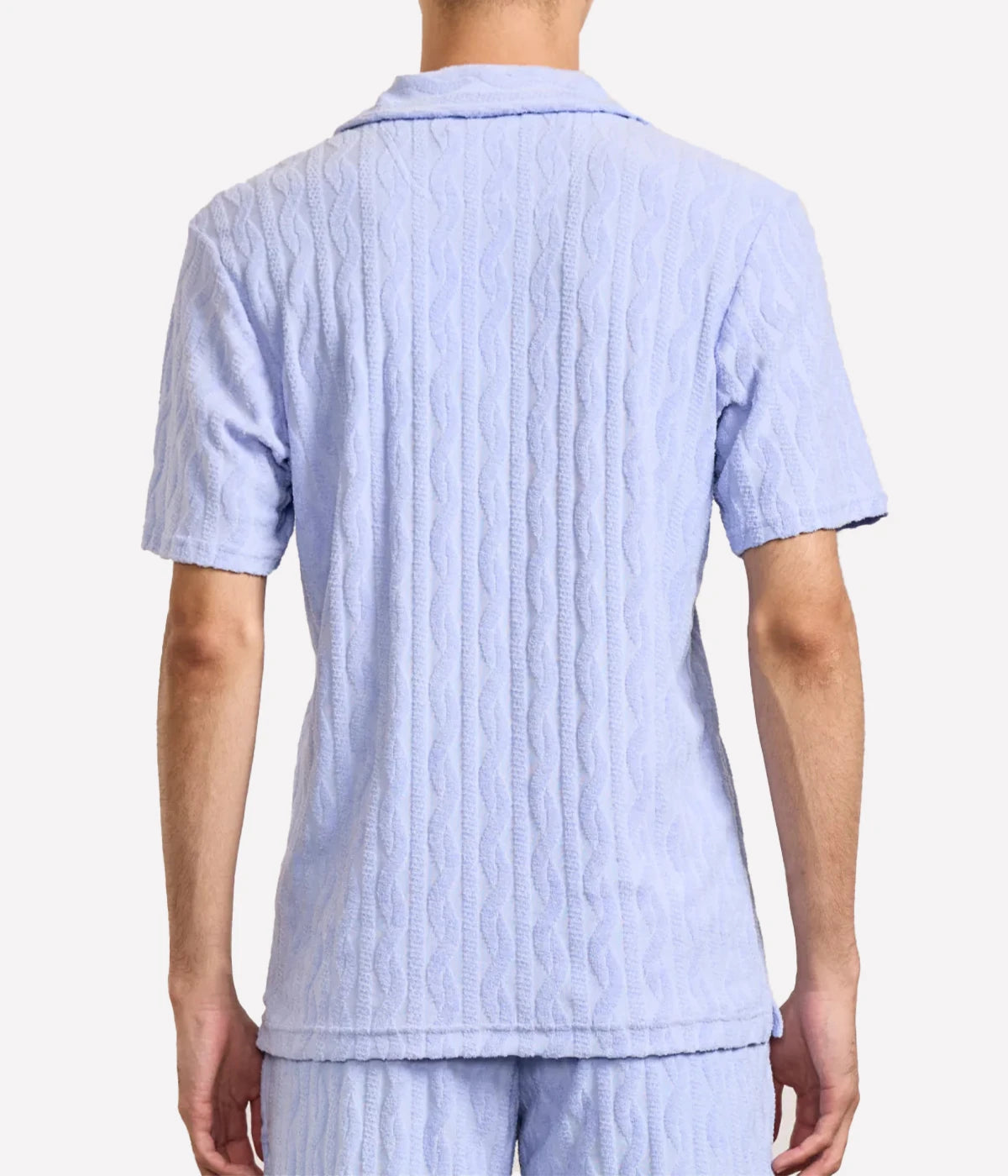 Faustino polo in organic Terry cotton with jacquard pattern, open camp collar, relaxed fit, and side slits. Buttonless collar for a modern twist.