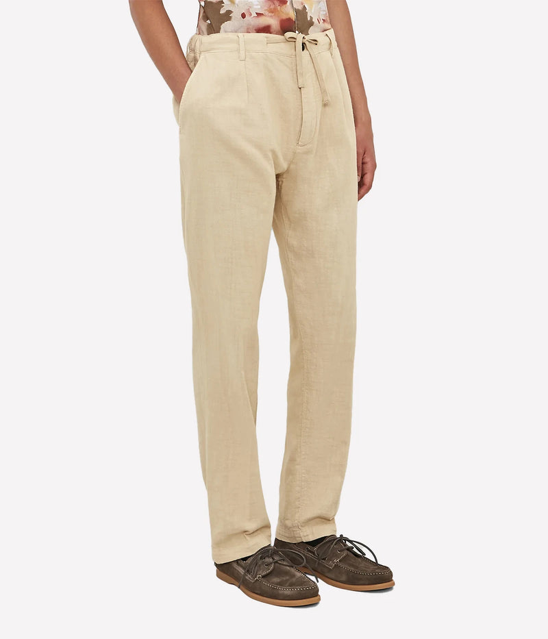 Men's comfort-fit cotton gauze trousers with pleats, elastic waistband, and slant pockets.