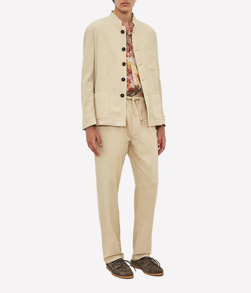 Men's comfort-fit cotton gauze trousers with pleats, elastic waistband, and slant pockets.