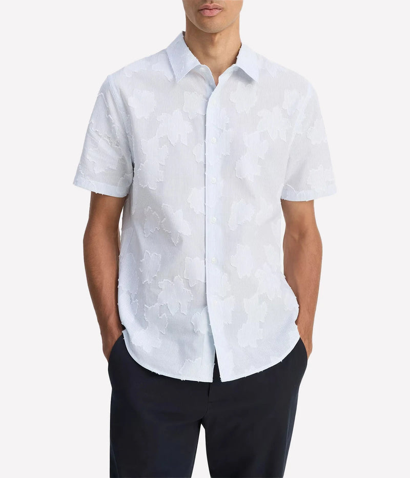 Vince men’s button-up shirt with fil coupé floral pattern layered on striped cotton, featuring a shirttail hem and pleated back.