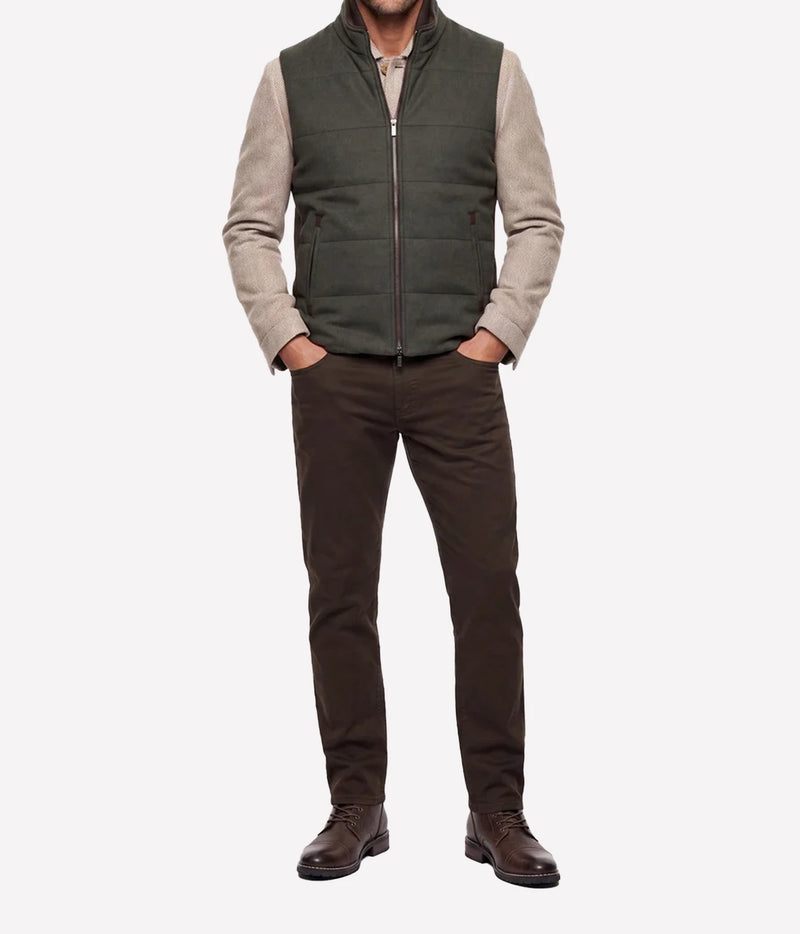 Full-length view of model wearing Maurizio Baldassari Arena Quilted Wool Vest in Dark Olive with dark brown trousers