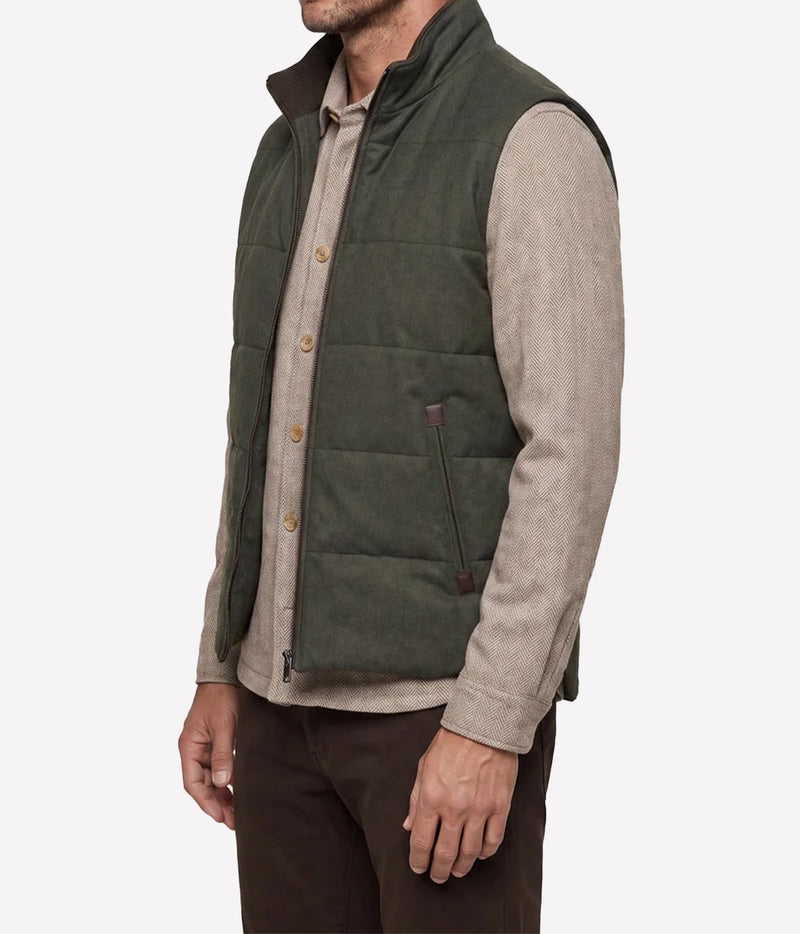 Side view of model wearing Maurizio Baldassari Arena Quilted Wool Vest in Dark Olive
