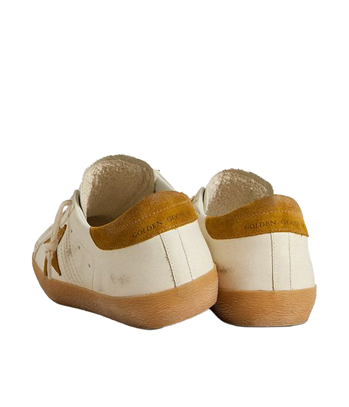 Golden Goose Superstar sneakers with white leather upper, tan suede star and heel tab, and retro-inspired gum sole. Made in Italy.