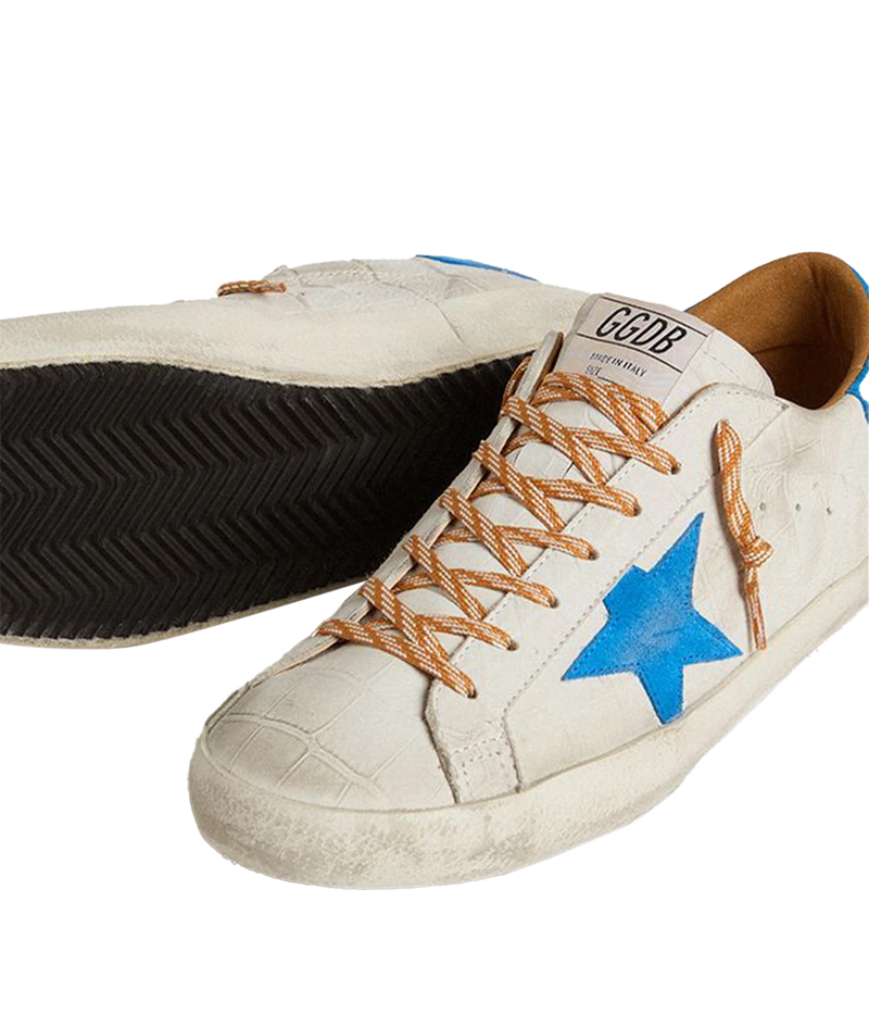Golden Goose Superstar sneakers with white crocodile-embossed leather, blue suede star and heel tab, and distressed detailing. Made in Italy.