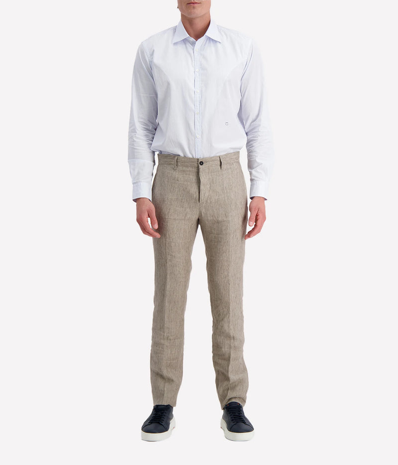 Regular-fit cotton shirt with a pointed collar, soft front placket, cotton voile inner bib, and custom badge embroidery. Made in Italy.