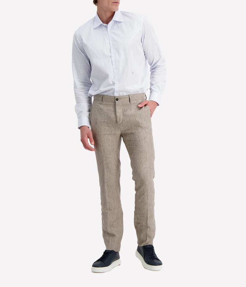 Regular-fit cotton shirt with a pointed collar, soft front placket, cotton voile inner bib, and custom badge embroidery. Made in Italy.