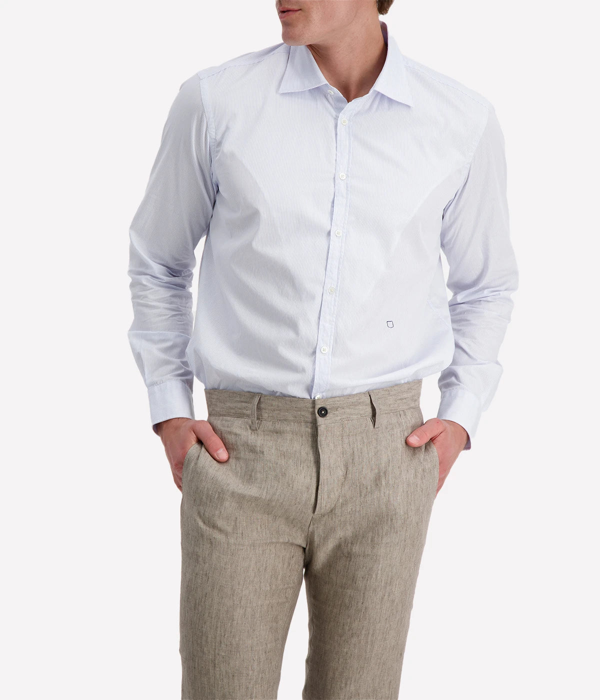 Regular-fit cotton shirt with a pointed collar, soft front placket, cotton voile inner bib, and custom badge embroidery. Made in Italy.