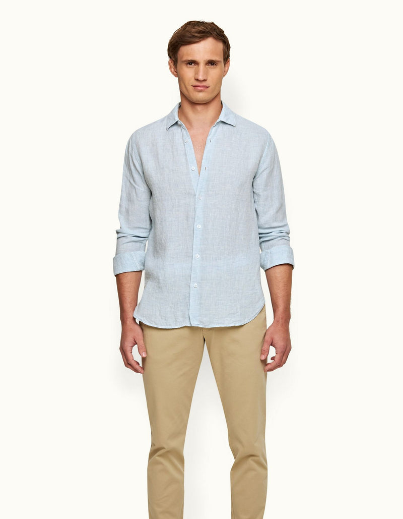 Giles long-sleeved linen shirt in 100% linen, featuring a classic collar, branded collar stay, imitation Mother of Pearl buttons, shaping darts, and loop tape detail under the back collar. Made in Portugal, perfect for holiday styling.