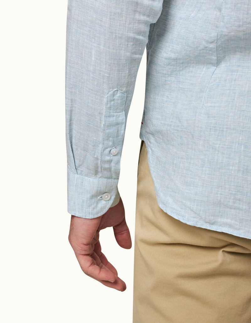 Giles long-sleeved linen shirt in 100% linen, featuring a classic collar, branded collar stay, imitation Mother of Pearl buttons, shaping darts, and loop tape detail under the back collar. Made in Portugal, perfect for holiday styling.