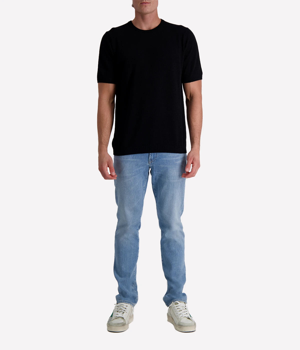 Black spongy-knit t-shirt crafted from a textured cotton blend, finished with ribbed details for a sleek and modern twist.