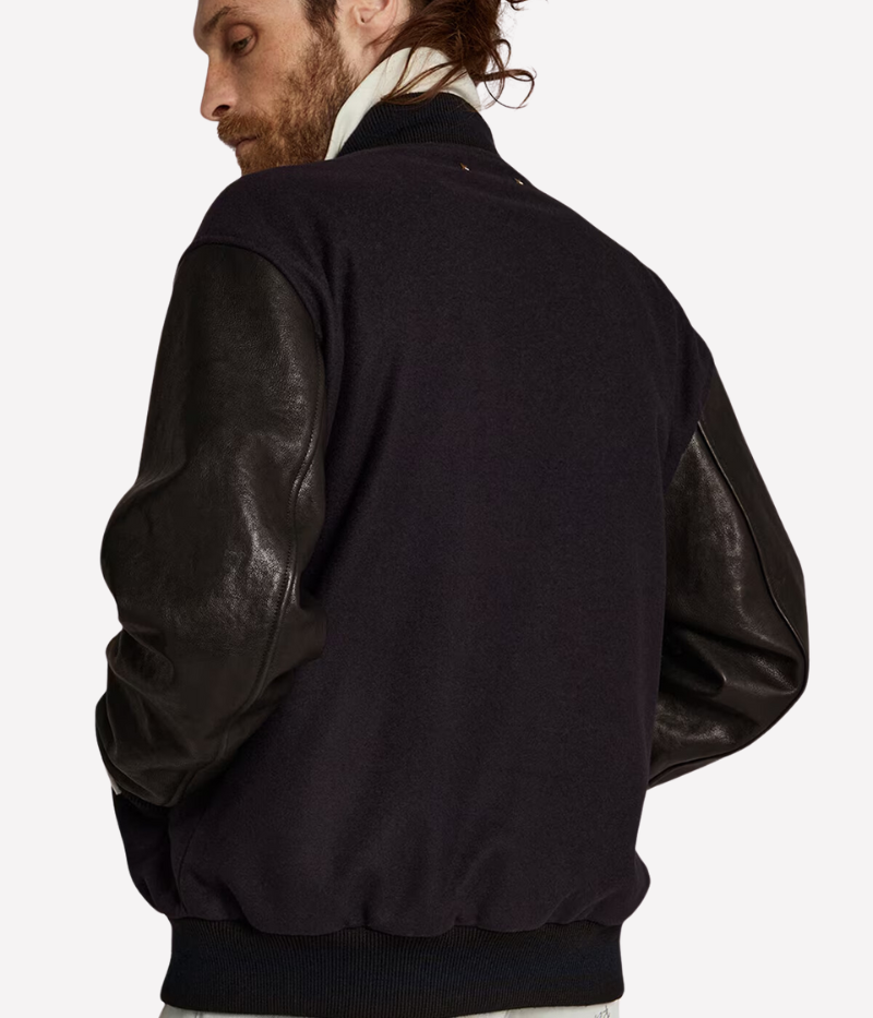 Golden Goose Golden Leather Bomber jacket in dark blue and black, featuring a wool blend body with distressed black leather sleeves and a signature double gold star detail on the back. Regular fit with button-up front, front pockets, and cotton lining for comfort. Crafted in Italy for a laid-back luxury look.