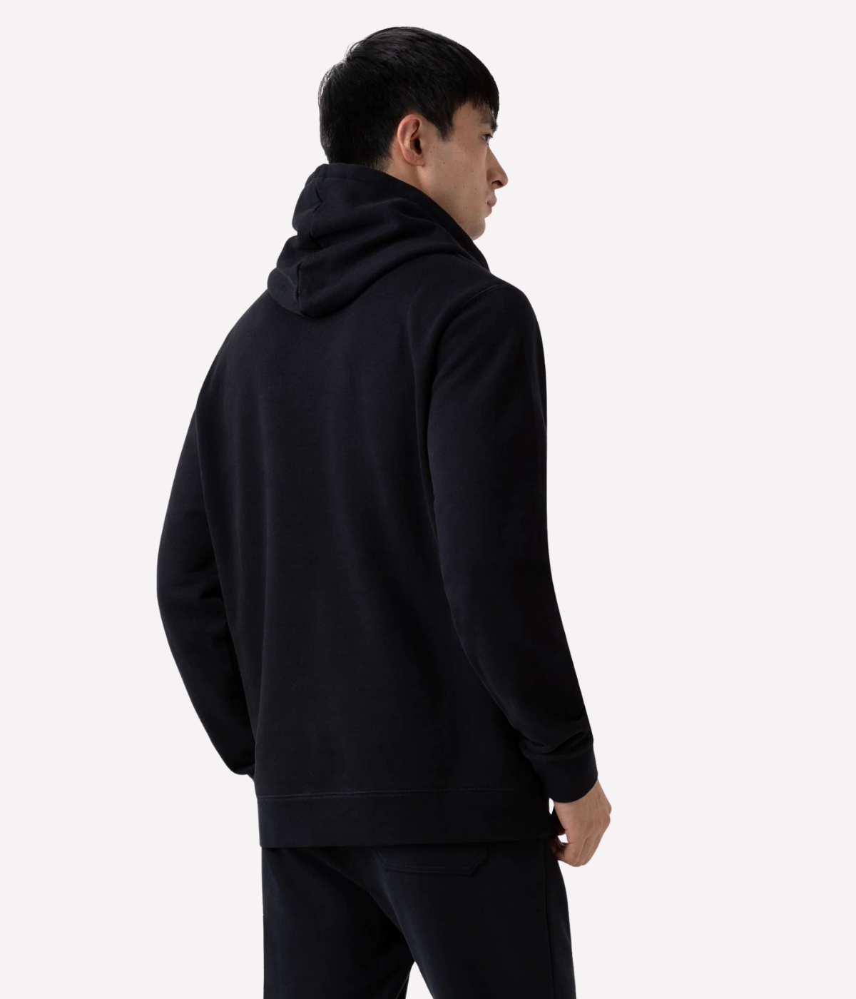 Men’s black loopback hoodie with double-layered hood, ribbed trims, and patch pocket—crafted from breathable cotton for year-round comfort.