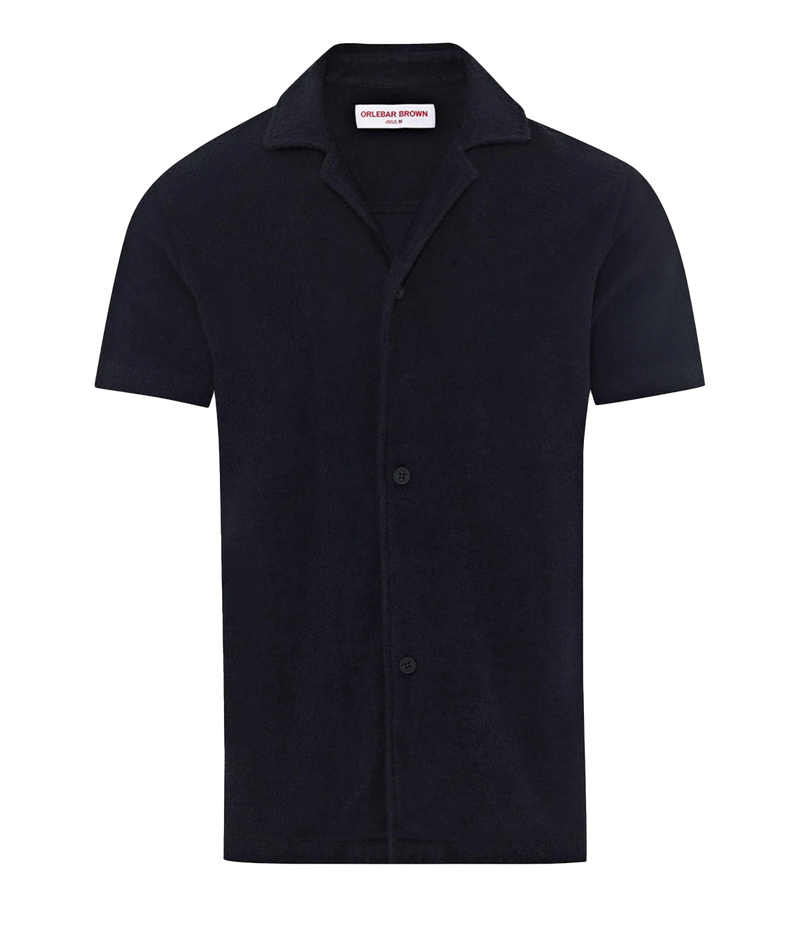 Night Iris Howell shirt from Orlebar Brown, crafted from double-faced towelling pique. Features a relaxed fit, Capri collar, 3-button opening, and branded nylon buttons. A versatile and stylish shirt perfect for summer and travel.