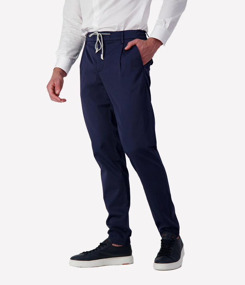 Eleventy tailored drawstring pants in navy jersey-effect cotton with subtle seam fading and sartorial detailing, made in Italy.