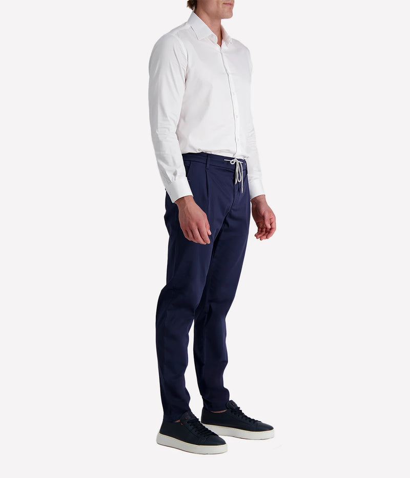 Eleventy tailored drawstring pants in navy jersey-effect cotton with subtle seam fading and sartorial detailing, made in Italy.