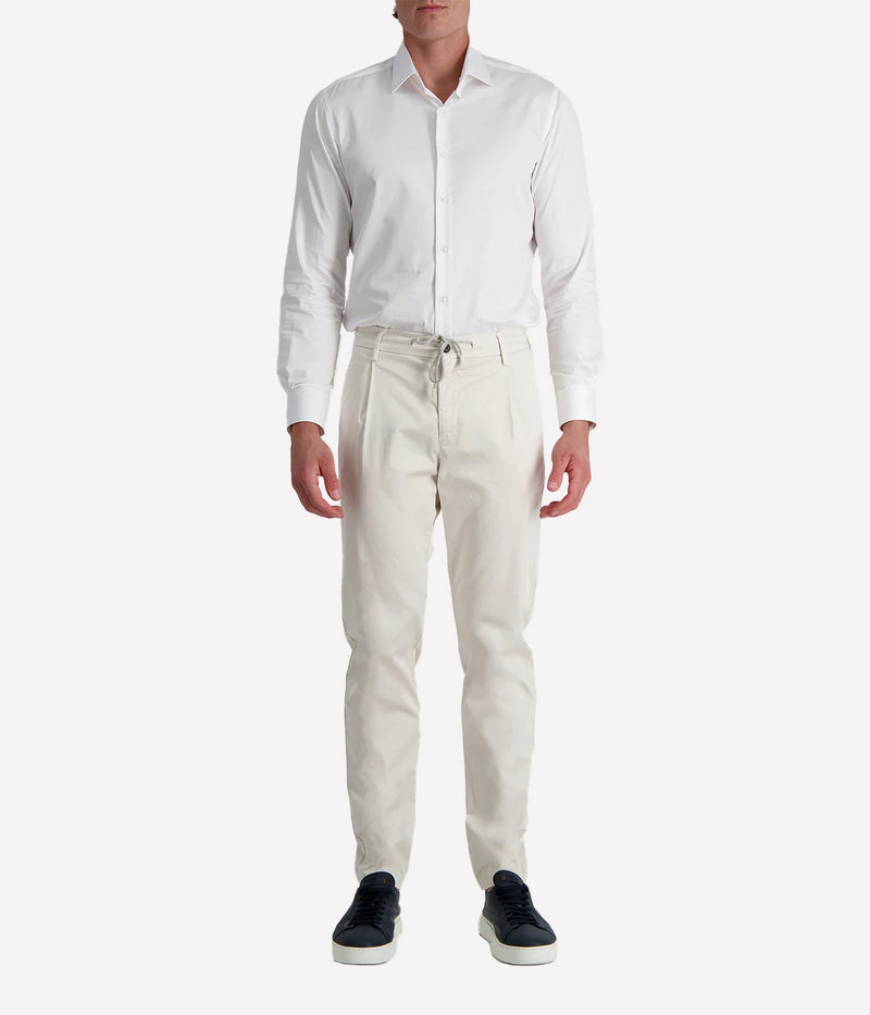 Eleventy tailored drawstring pants in sand jersey-effect cotton with subtle seam fading and sartorial detailing, made in Italy.