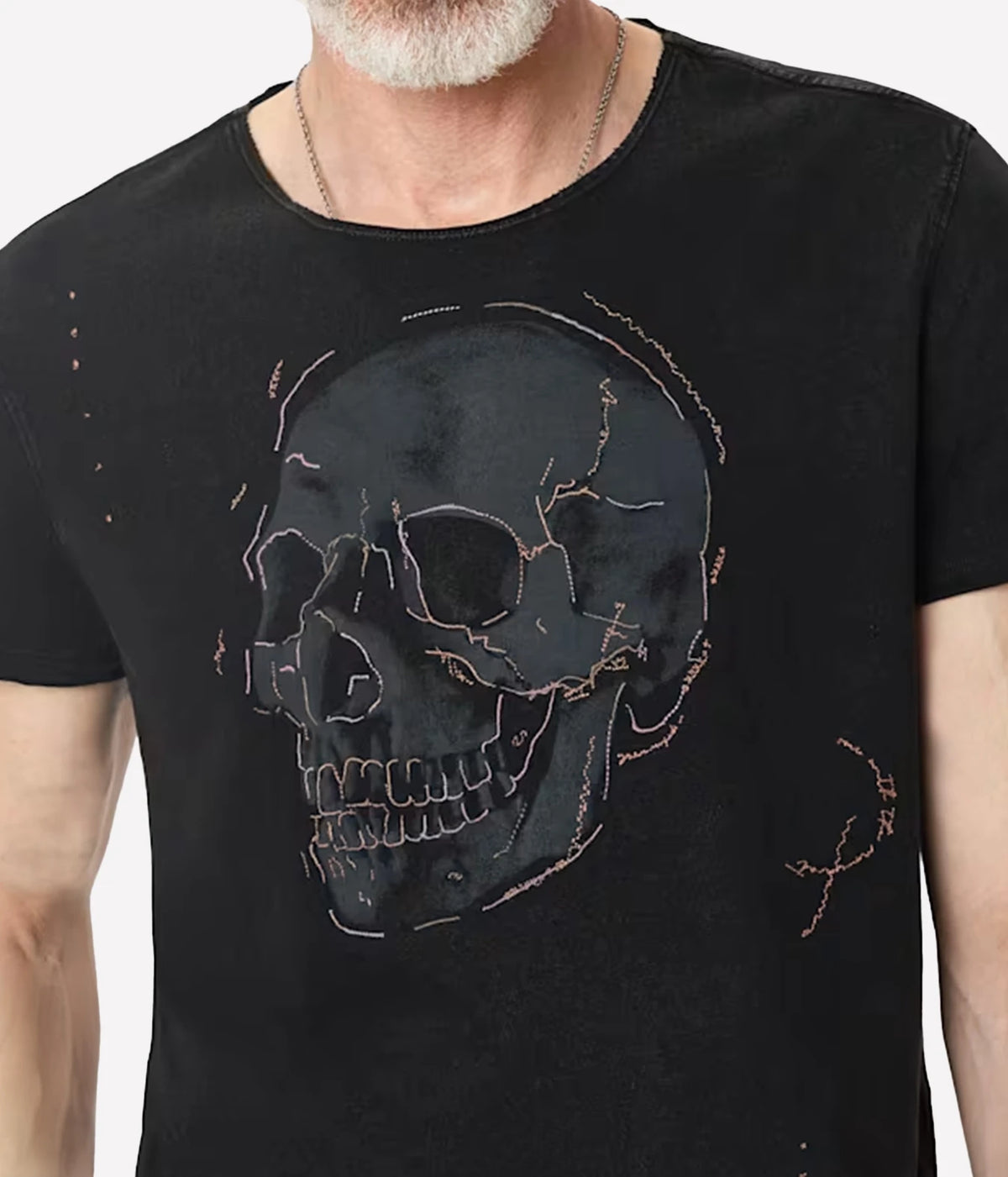 Close-up of John Varvatos Skull Embroidery Raw Edge Tee in Black on model showing the screen-printed skull and embroidery