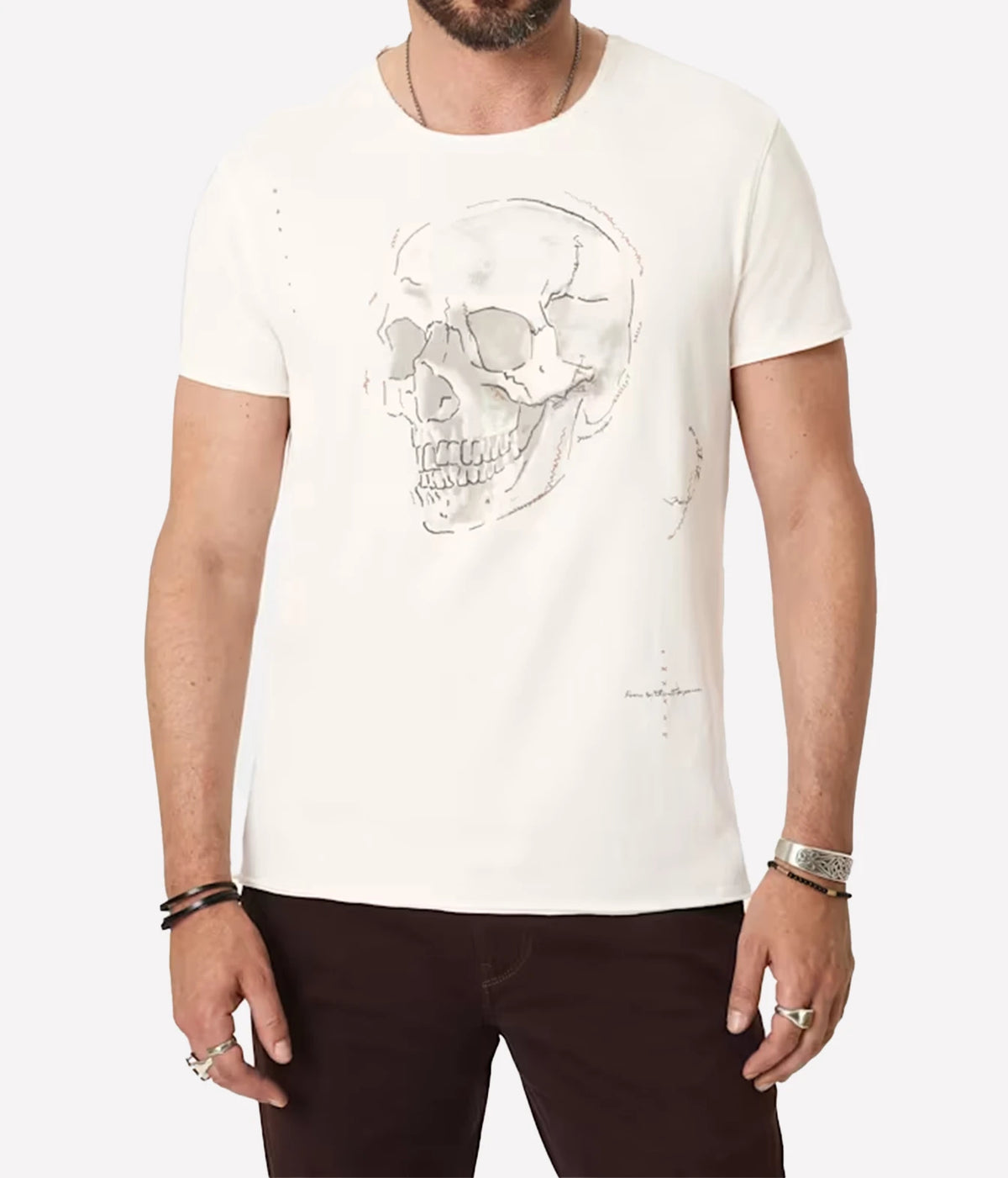 Man wearing John Varvatos Skull Embroidery Raw Edge Tee in Salt with dark brown trousers, front view
