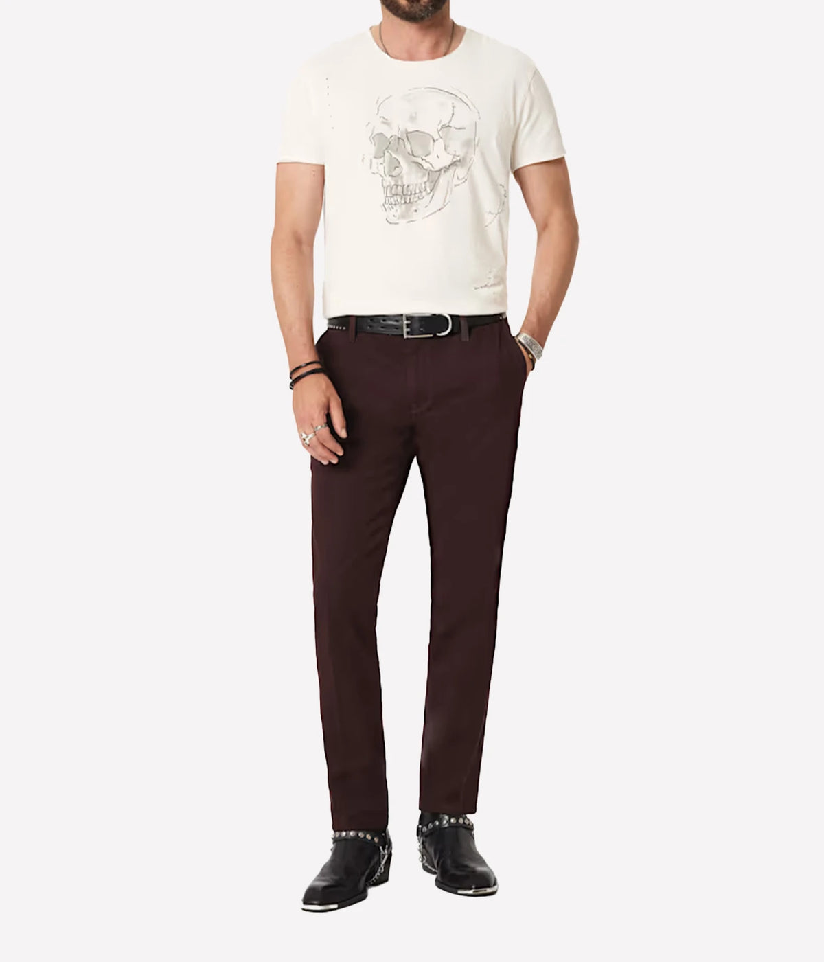 Man wearing John Varvatos Skull Embroidery Raw Edge Tee in Salt with dark brown trousers, full-length front view