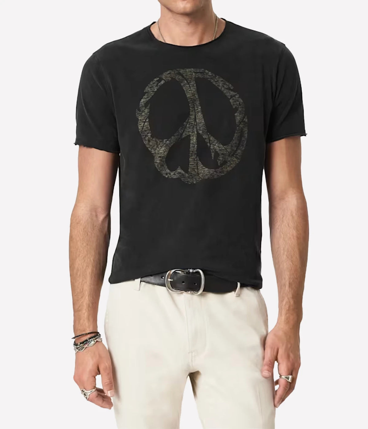 Man wearing John Varvatos Peace Maker Raw Edge Tee in Black with off-white trousers and a black belt, front view