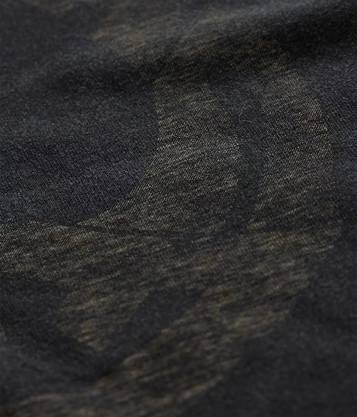 Close-up of John Varvatos Peace Maker Raw Edge Tee in Black showing the reverse-print artwork on the fabric