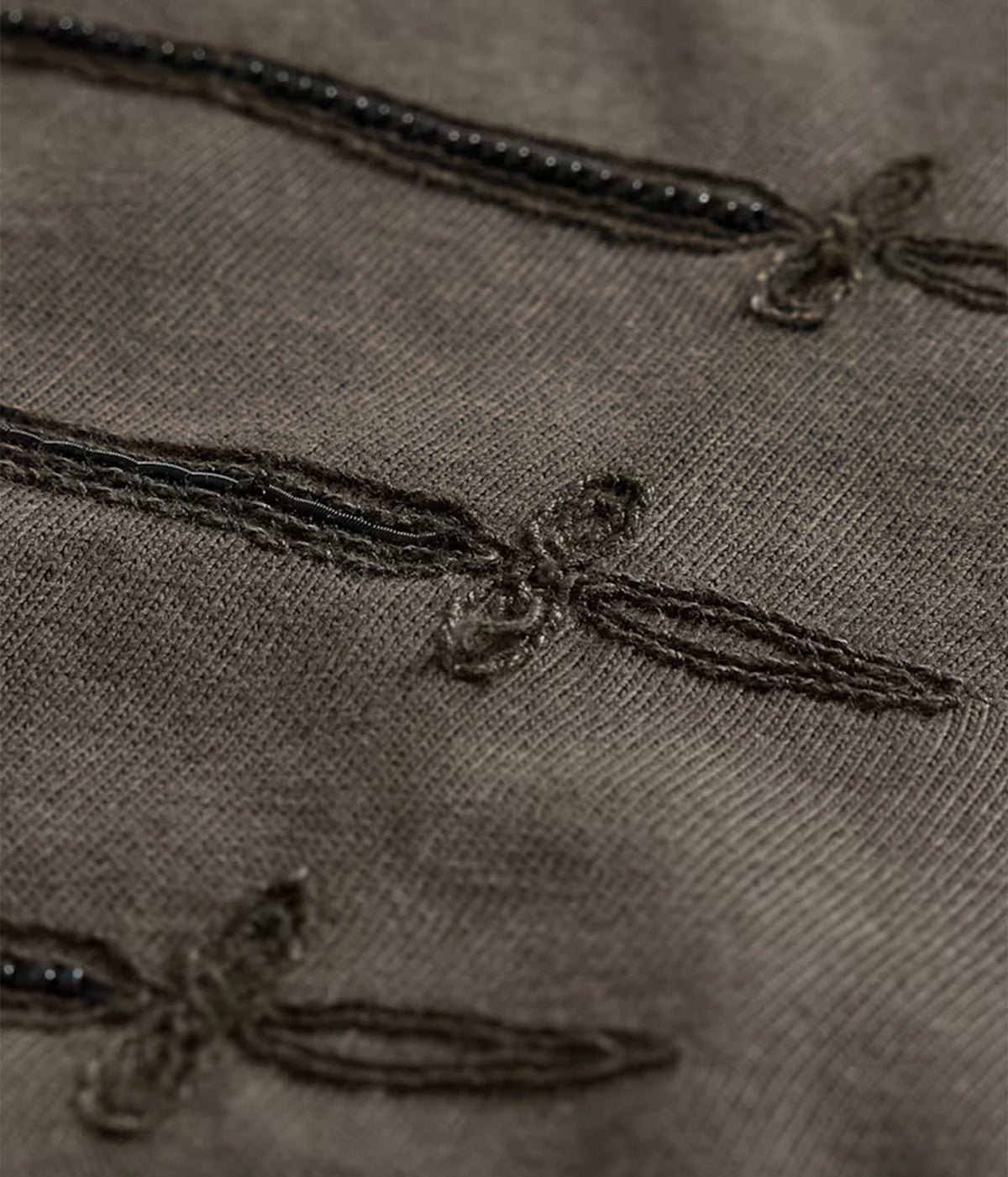 Close-up of John Varvatos Sword Piping Embroidered Tee in Teakwood showing the bullion embroidery and beadwork