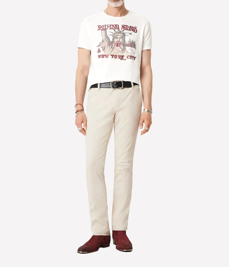 Man wearing John Varvatos The Rolling Stones NYC Raw Edge Tee in Salt with stone trousers, full-length front view