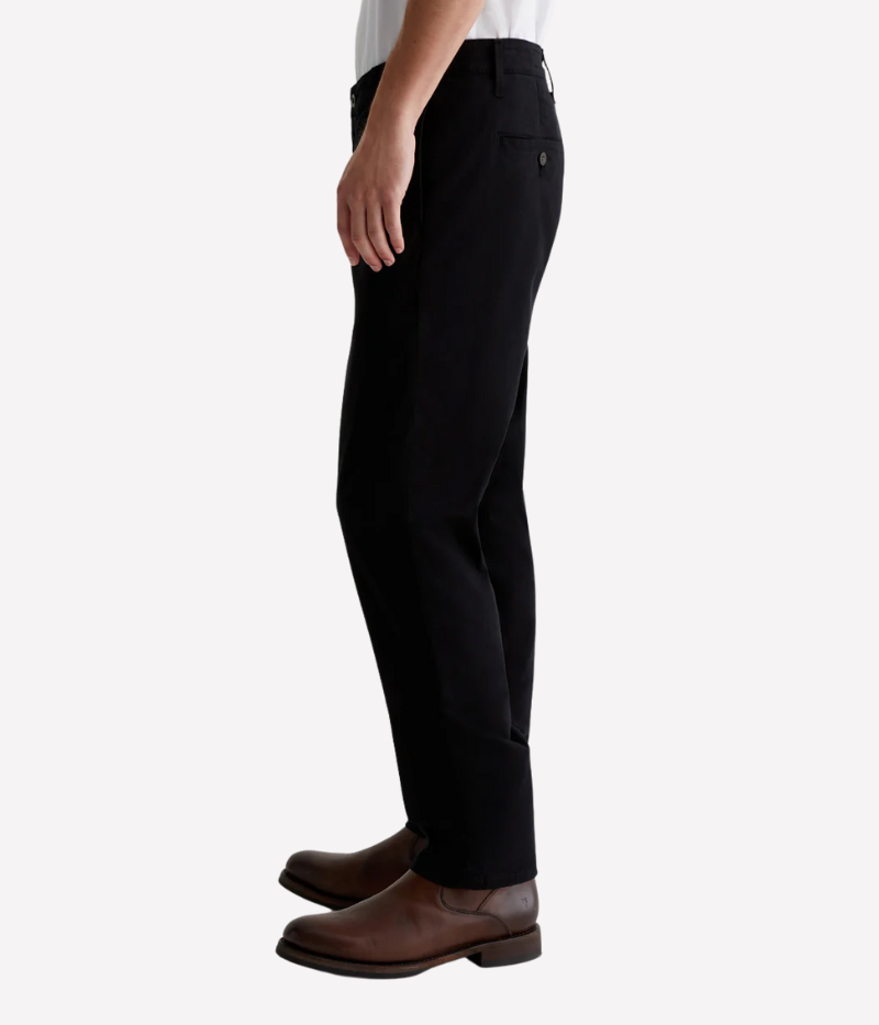 A versatile slim-fit trouser designed for modern men who appreciate style and comfort. Crafted from premium Sorrento Stretch Twill, these black trousers offer a tailored look with flexibility, making them perfect for both casual and elevated occasions.