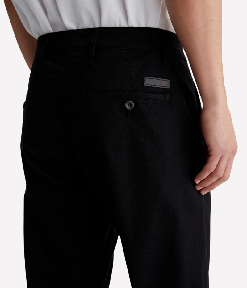 A versatile slim-fit trouser designed for modern men who appreciate style and comfort. Crafted from premium Sorrento Stretch Twill, these black trousers offer a tailored look with flexibility, making them perfect for both casual and elevated occasions.