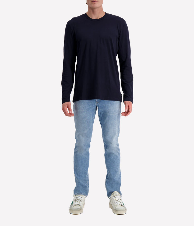 Long-sleeve crew neck shirt in ultra-soft 100% cotton, garment-dyed for a relaxed, lived-in feel. Classic fit with clean-finished hems, perfect for layering or wearing solo.
