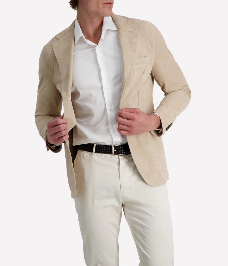 Eleventy sand leather blazer featuring a slim, tailored fit and notch lapels. Crafted from soft leather for a refined look.