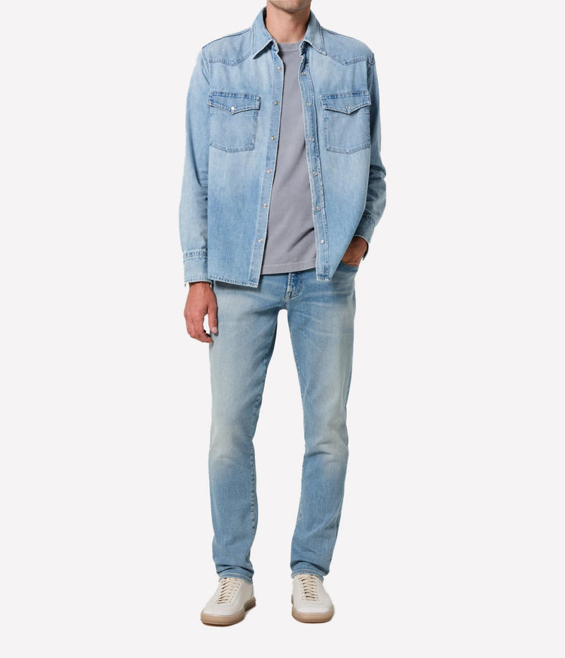 London Jean in Pavilion by Citizens of Humanity, featuring a slim fit through the hip and thigh with a tapered leg. Crafted from a stretch-enhanced fabric blend in a versatile mid-blue wash, these jeans offer a sleek, modern silhouette perfect for both casual and elevated looks.