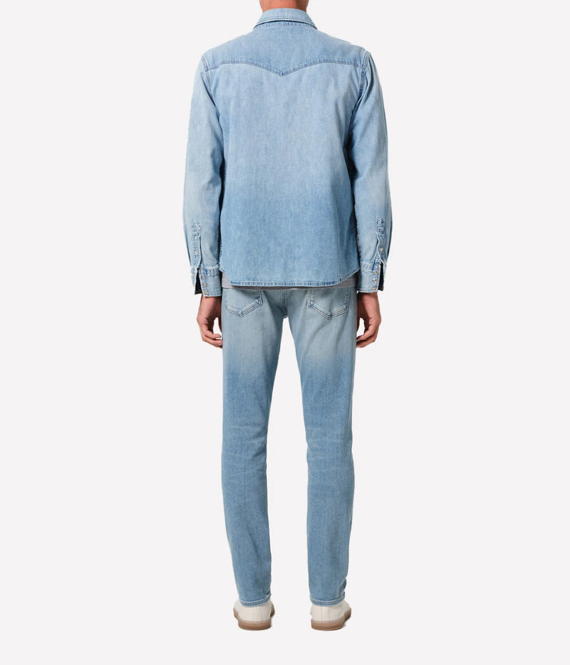 London Jean in Pavilion by Citizens of Humanity, featuring a slim fit through the hip and thigh with a tapered leg. Crafted from a stretch-enhanced fabric blend in a versatile mid-blue wash, these jeans offer a sleek, modern silhouette perfect for both casual and elevated looks.